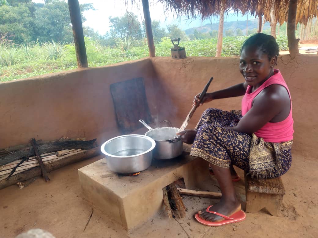 A beneficiary using NJASYO Cookstove